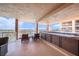 Enjoy city views from this condo balcony with a private jacuzzi, seating and entertainment space at 11525 Gulf Blvd # 401, Treasure Island, FL 33706