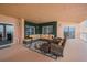 Spacious condo balcony with comfortable seating area, ivy wall, and picturesque cityscape views at 11525 Gulf Blvd # 401, Treasure Island, FL 33706