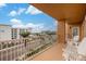 Relax on this beachfront condo balcony with white Adirondack chairs overlooking a city view at 11525 Gulf Blvd # 401, Treasure Island, FL 33706