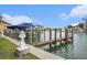 Boat dock with dockside power, boat lift and canal access at 11525 Gulf Blvd # 401, Treasure Island, FL 33706
