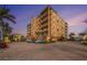 Stately condo building boasts multi-level balconies, brick-paved parking and tropical landscaping at 11525 Gulf Blvd # 401, Treasure Island, FL 33706