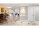Large hall boasts beautiful tile flooring, a display niche, and access to a balcony at 11525 Gulf Blvd # 401, Treasure Island, FL 33706