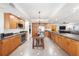 Well-equipped kitchen with wooden cabinetry, stainless steel appliances, and granite countertops at 11525 Gulf Blvd # 401, Treasure Island, FL 33706