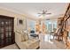 Comfortable living room with a sectional sofa and sliding doors leading to a balcony at 11525 Gulf Blvd # 401, Treasure Island, FL 33706