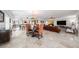 Expansive living space with a dining area, kitchen, and comfortable seating arrangements at 11525 Gulf Blvd # 401, Treasure Island, FL 33706