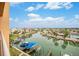 Scenic water view featuring a canal, docks, and boat slips, offering a glimpse of waterfront living at 11525 Gulf Blvd # 401, Treasure Island, FL 33706