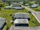 Aerial view of a quaint neighborhood with well-kept lawns and tree-lined streets at 124 Gloucester Blvd # 355J, Sun City Center, FL 33573