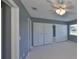 Bedroom with a ceiling fan, neutral paint and carpet and closet with sliding doors at 124 Gloucester Blvd # 355J, Sun City Center, FL 33573