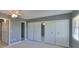 Bedroom featuring neutral carpet and wall paint, a ceiling fan, and sliding closet doors at 124 Gloucester Blvd # 355J, Sun City Center, FL 33573