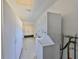 Laundry room with washer and dryer, storage cabinets, and access to the exterior at 124 Gloucester Blvd # 355J, Sun City Center, FL 33573