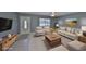 Living room featuring neutral colors, comfortable seating, and a bright front entrance at 124 Gloucester Blvd # 355J, Sun City Center, FL 33573