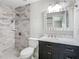 Stylish bathroom featuring a gray tiled shower and modern vanity at 1247 Holiday Dr, Tarpon Springs, FL 34689