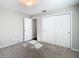 Bedroom with carpeted floors, closet and entryway at 1247 Holiday Dr, Tarpon Springs, FL 34689