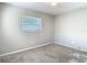 Bedroom featuring carpeted floors and a sunlit window at 1247 Holiday Dr, Tarpon Springs, FL 34689