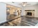 Spacious open-concept living area with a fireplace and connection to the modern kitchen at 1247 Holiday Dr, Tarpon Springs, FL 34689