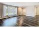 Inviting living room with a large window and neutral paint, featuring modern flooring and ample space for gatherings at 1247 Holiday Dr, Tarpon Springs, FL 34689