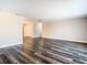 Spacious living room featuring modern flooring and neutral paint, offering a blank canvas for personalization and comfortable living at 1247 Holiday Dr, Tarpon Springs, FL 34689