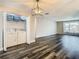 Open-concept living area features sleek flooring, laundry closet, and abundant natural light at 1247 Holiday Dr, Tarpon Springs, FL 34689