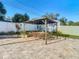 Outdoor dining area with table, chairs and shade at 1247 Holiday Dr, Tarpon Springs, FL 34689