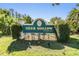 Deer Hollow at East Lake community sign surrounded by manicured landscaping at 1333 Shady Pine Way # B, Tarpon Springs, FL 34688