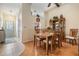 Open concept dining room features a view of the front door and display cabinet at 1333 Shady Pine Way # B, Tarpon Springs, FL 34688