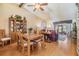 Open concept dining room with wood table and chairs and view of living room at 1333 Shady Pine Way # B, Tarpon Springs, FL 34688