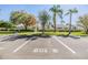 Exterior view of the townhome with dedicated parking, lush landscaping, and well-maintained grounds, adding to the curb appeal at 1333 Shady Pine Way # B, Tarpon Springs, FL 34688