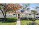 Pleasant townhome exterior with manicured lawn and walkway leading to a cozy entrance, creating an inviting and appealing view at 1333 Shady Pine Way # B, Tarpon Springs, FL 34688