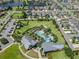 Aerial view of a community pool and clubhouse, a great place to gather with friends and Gathering at 14885 Caravan Ave, Odessa, FL 33556