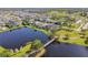 Beautiful aerial view of backyard of home and lake in a desirable community and easy access to amenities at 14885 Caravan Ave, Odessa, FL 33556