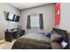 Bedroom boasts neutral walls, carpet, a large window, with sports decor on the walls at 14885 Caravan Ave, Odessa, FL 33556