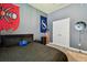 Bedroom with carpet, sports decor, and a closet with double doors at 14885 Caravan Ave, Odessa, FL 33556