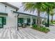 Patio area with outdoor seating, shade, and lush landscaping at 14885 Caravan Ave, Odessa, FL 33556
