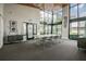 Bright clubhouse with large windows, stylish chandeliers, and a long conference table and chairs at 14885 Caravan Ave, Odessa, FL 33556