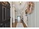 Inviting foyer features hardwood floors, a neutral palette, and an open view of the living spaces at 14885 Caravan Ave, Odessa, FL 33556