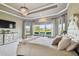 Bright main bedroom with large windows, plush carpeting, and great views at 14885 Caravan Ave, Odessa, FL 33556