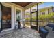 Screened patio with outdoor kitchen and view of the yard at 14885 Caravan Ave, Odessa, FL 33556