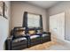 Theater room featuring tiered seating, carpet, window, and a wall art at 14885 Caravan Ave, Odessa, FL 33556