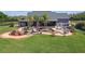The backyard features a custom pool with a tropical design, surrounded by lush landscaping at 19530 Barrie Acres Trl, Odessa, FL 33556