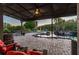 Backyard features a rock pool, an outdoor firepit area, and a covered patio seating at 19530 Barrie Acres Trl, Odessa, FL 33556
