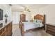 Bedroom featuring a wooden bed frame, matching dresser and carpet floors at 19530 Barrie Acres Trl, Odessa, FL 33556