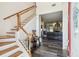 Bright foyer with hardwood floors, stairway and open doorway to the spacious living room at 19530 Barrie Acres Trl, Odessa, FL 33556