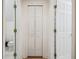 Hallway view of bathroom, closet and room with wood floors at 19530 Barrie Acres Trl, Odessa, FL 33556