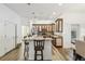 Bright kitchen with a center island, bar stools, pendant lights, and wood-look floors at 19530 Barrie Acres Trl, Odessa, FL 33556