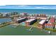 Beautiful aerial view of waterfront condos with a community pool and private boat docks at 19701 Gulf Blvd # 231, Indian Shores, FL 33785