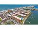 Stunning aerial view of waterfront condos, sandy beach, and blue ocean at 19701 Gulf Blvd # 231, Indian Shores, FL 33785