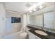 Clean bathroom featuring tub-shower combination with granite countertop at 19701 Gulf Blvd # 231, Indian Shores, FL 33785