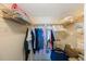 Organized walk-in closet with shelving and hanging space for clothes and storage at 19701 Gulf Blvd # 231, Indian Shores, FL 33785
