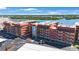Condominium exterior showcasing lush landscaping, convenient parking, and waterfront location at 19701 Gulf Blvd # 231, Indian Shores, FL 33785