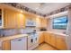 Well-equipped kitchen with a range, built-in microwave, and ample cabinet space at 19701 Gulf Blvd # 231, Indian Shores, FL 33785